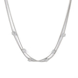 Двойно колие с плетка и кубчета в сребрист цвят, изработено от медицинска стомана.