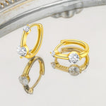 Сребърни Обеци Lumi S925 с блестящи кристали и елегантен дизайн на огледална повърхност.